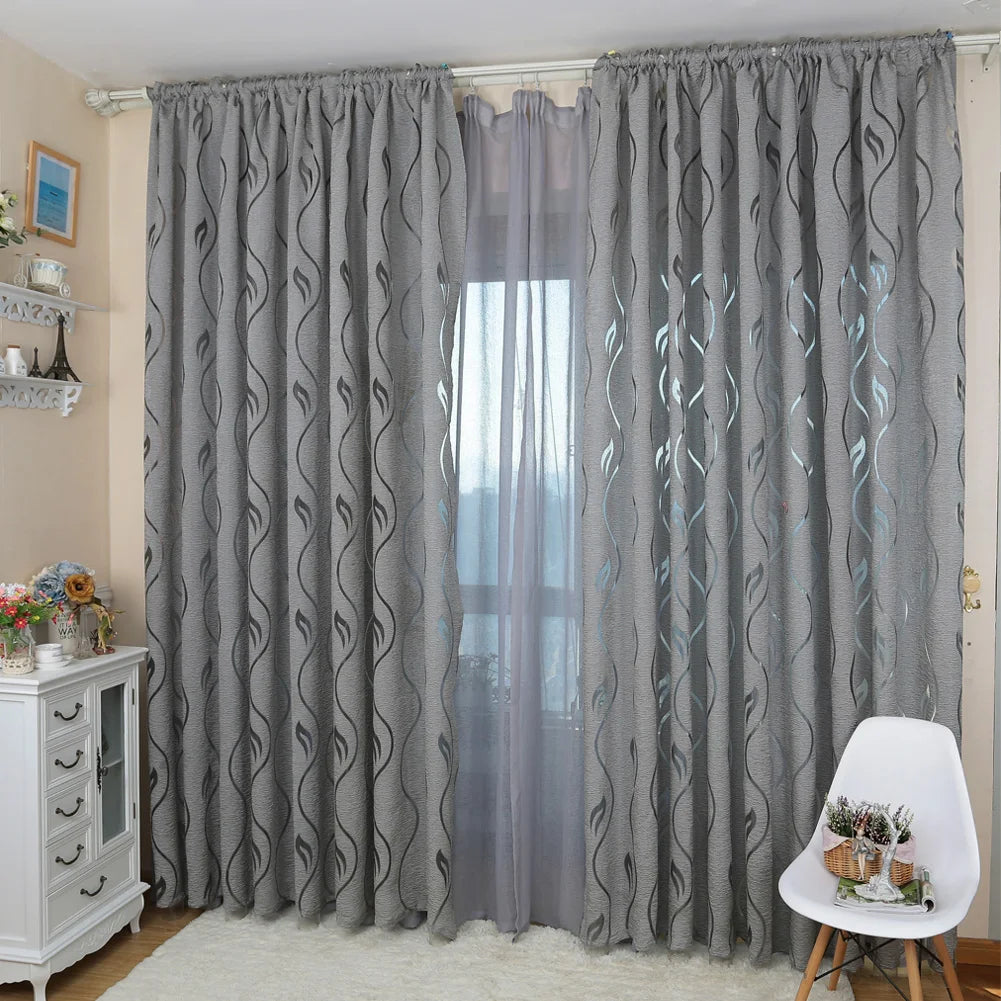 Rideau jacquard gris motif feuilles ajouré, largeur 100 à 139 cm